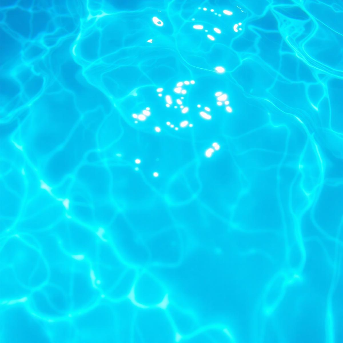 Sunlight caustics dancing across clear turquoise water.